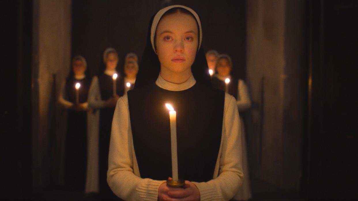  Sydney Sweeney in Immaculate holding a candle. . 