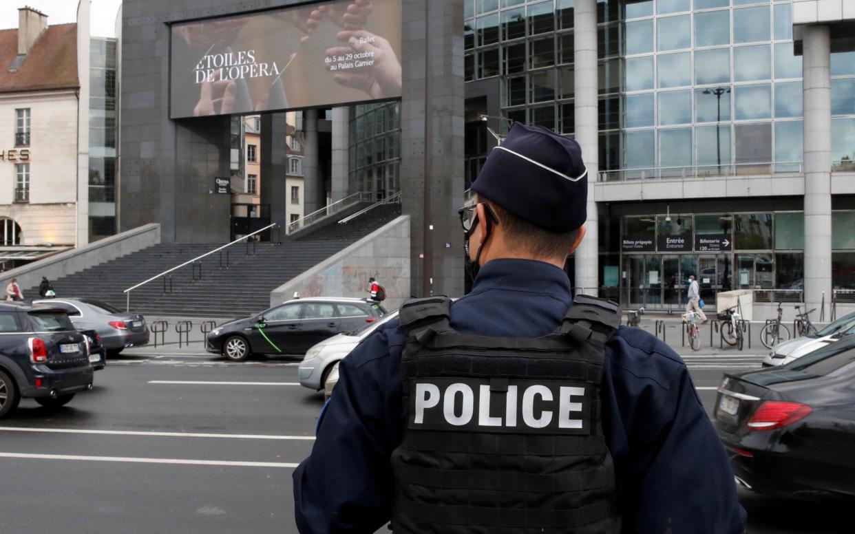 A French police officer stands near the Opera Bastille where the man was arrested - REUTERS/Gonzalo Fuentes/File Photo