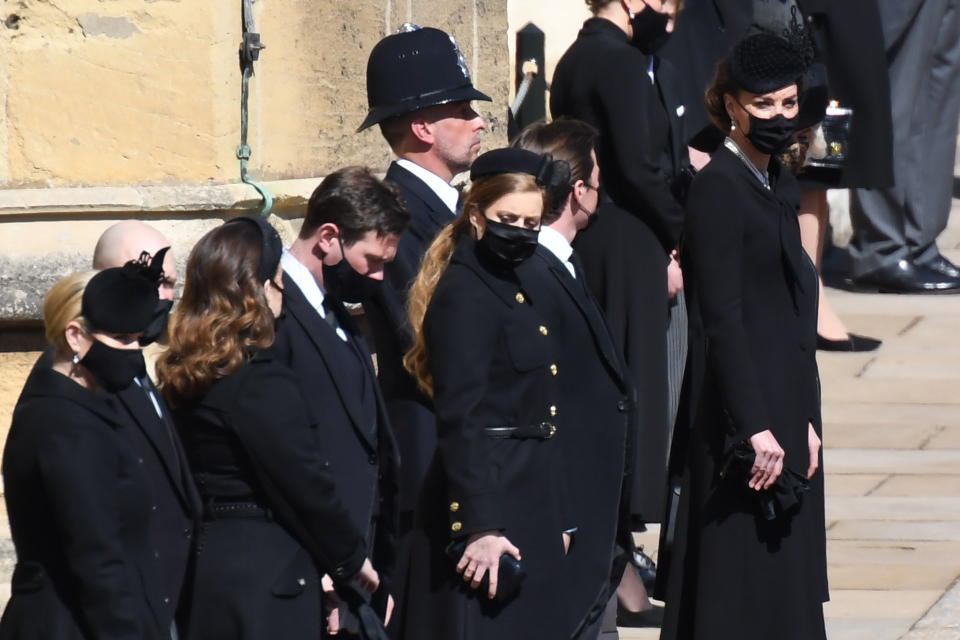 WINDSOR, ENGLAND - APRIL 17: Zara Tindall, Mike Tindall, Princess Eugenie, Jack Brooksbank, Princess Beatrice,  Edoardo Mapelli Mozzi, Catherine, Duchess of Cambridge and Camilla, Duchess of Cornwall stand outside St George's Chapel for the funeral service of Britain's Prince Philip, Duke of Edinburgh in Windsor Castle on April 17, 2021 in Windsor, United Kingdom. Prince Philip of Greece and Denmark was born 10 June 1921, in Greece. He served in the British Royal Navy and fought in WWII. He married the then Princess Elizabeth on 20 November 1947 and was created Duke of Edinburgh, Earl of Merioneth, and Baron Greenwich by King VI. He served as Prince Consort to Queen Elizabeth II until his death on April 9 2021, months short of his 100th birthday. His funeral takes place today at Windsor Castle with only 30 guests invited due to Coronavirus pandemic restrictions. (Photo by Jeremy Selwyn-WPA Pool/Getty Images)