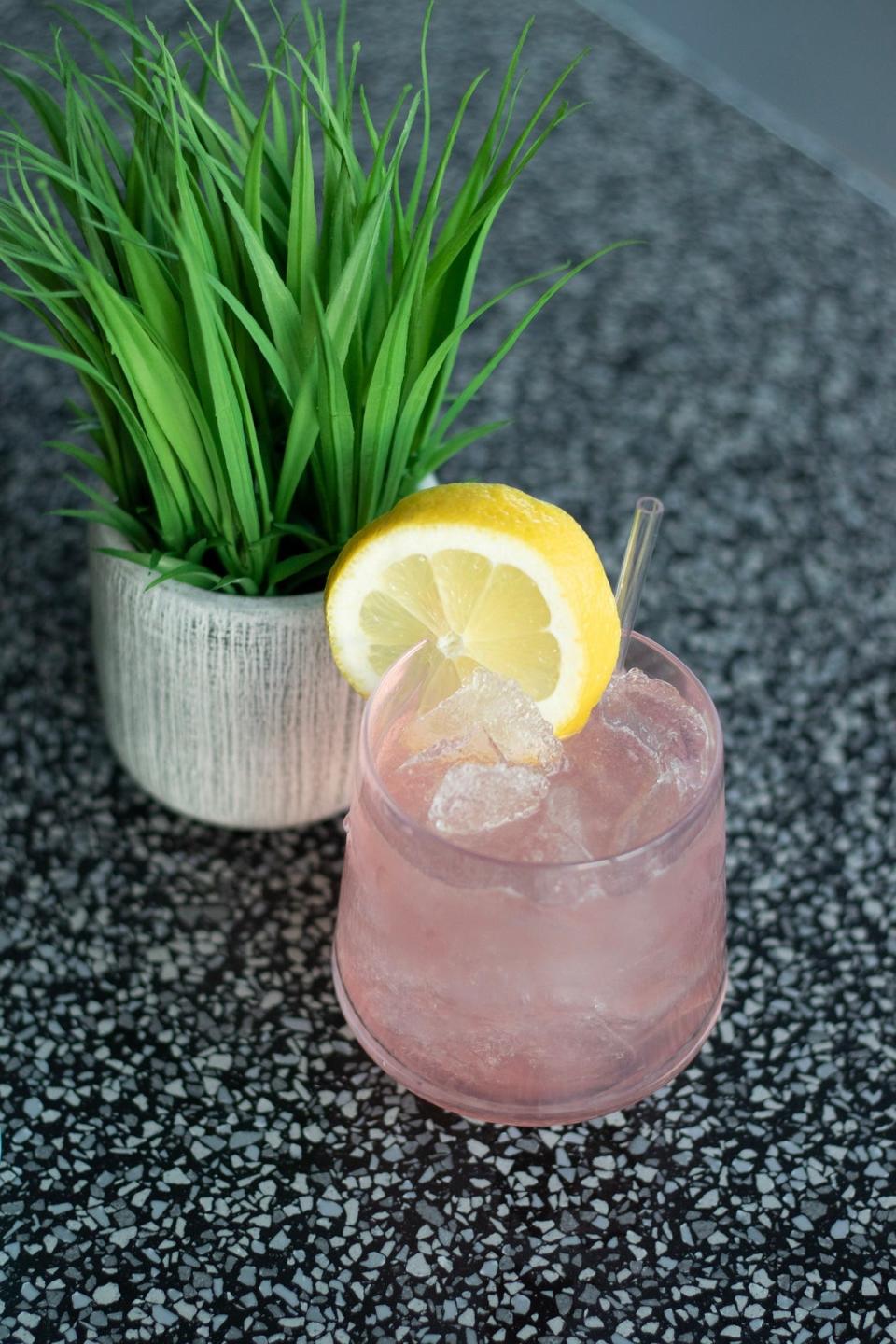 The Kissed By A Rose cocktail at Alibi, downtown Tempe's newest rooftop pool bar. The cocktail is made with Effen Rose Vodka, Pama Marie Brizard, watermelon, lemon juice and hibiscus flower water.