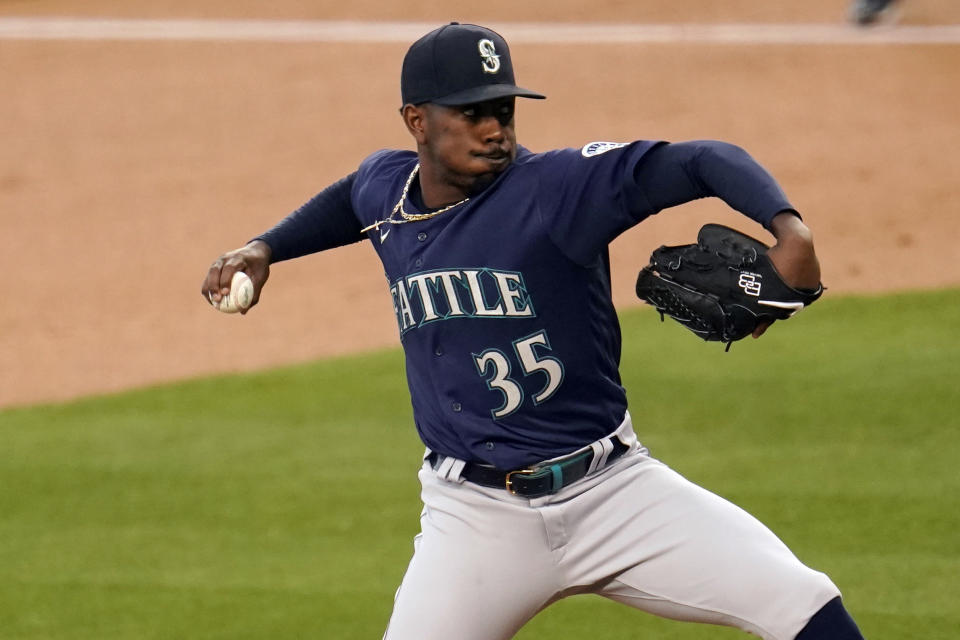 Seattle Mariners starting pitcher Justin Dunn throws to a Los Angeles Dodgers batter during the first inning of a baseball game Wednesday, May 12, 2021, in Los Angeles. (AP Photo/Marcio Jose Sanchez)