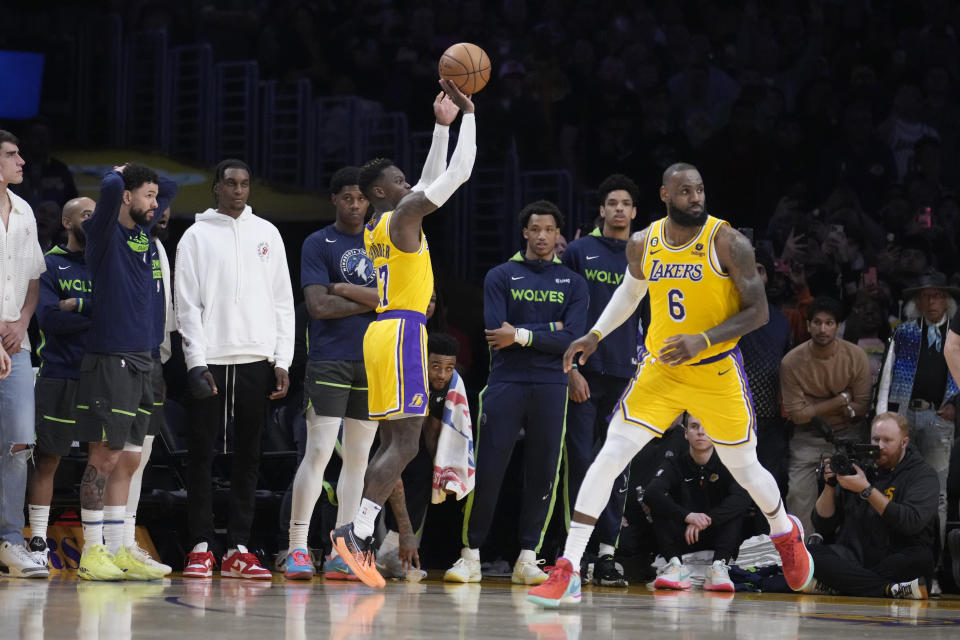 Los Angeles Lakers guard Dennis Schroder (17) makes a 3-point basket in the closing seconds of the fourth quarter of the team's NBA basketball play-in tournament game against the Minnesota Timberwolves on Tuesday, April 11, 2023, in Los Angeles. (AP Photo/Marcio Jose Sanchez)