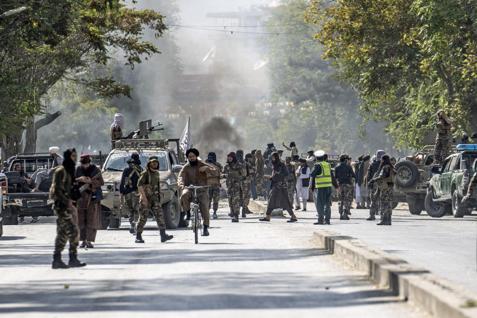 FILE - Taliban fighters stand guard at the explosion site, near a mosque, in Kabul, Afghanistan, Friday, Sept. 23, 2022. On Friday, an explosion occurred near a mosque in Afghanistan's capital of Kabul, with police confirming casualties. AP Photo/Ebrahim Noroozi, File)