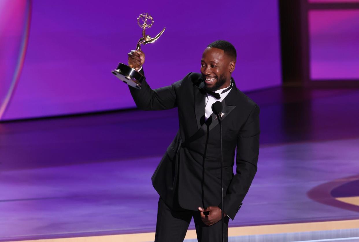 Lamorne Morris lifts his Emmy for supporting actor in a limited series or TV movie