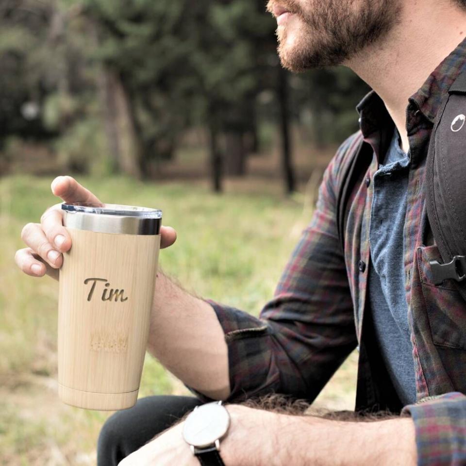 <p>This reusable travel mug is made from bamboo and has your name engraved into it! It's stylish, practical and environmentally friendly! </p><p><strong><strong>Not On The High Street</strong></strong>, <strong>£21.75</strong></p><p><a class="link " href="https://go.redirectingat.com?id=127X1599956&url=https%3A%2F%2Fwww.notonthehighstreet.com%2Fedgeinspired%2Fproduct%2Fpersonalised-name-reusable-travel-mug&sref=https%3A%2F%2Fwww.delish.com%2Fuk%2Fkitchen-accessories%2Fg29229984%2Fpersonalised-mugs%2F" rel="nofollow noopener" target="_blank" data-ylk="slk:BUY NOW;elm:context_link;itc:0;sec:content-canvas">BUY NOW</a> </p>