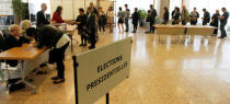 People line up to vote at a polling station in the first round of 2017 French presidential election in Vaulx-en-Velin, France, April 23, 2017. REUTERS/Emannuel Foudrot