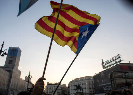 Demonstrators wave Esteladas (Catalan separatist flags) in the Puerta del Sol during a demonstration in favour of a proposed October 1 independence referendum, in Madrid, Spain, September 20, 2017. REUTERS/Paul Hanna