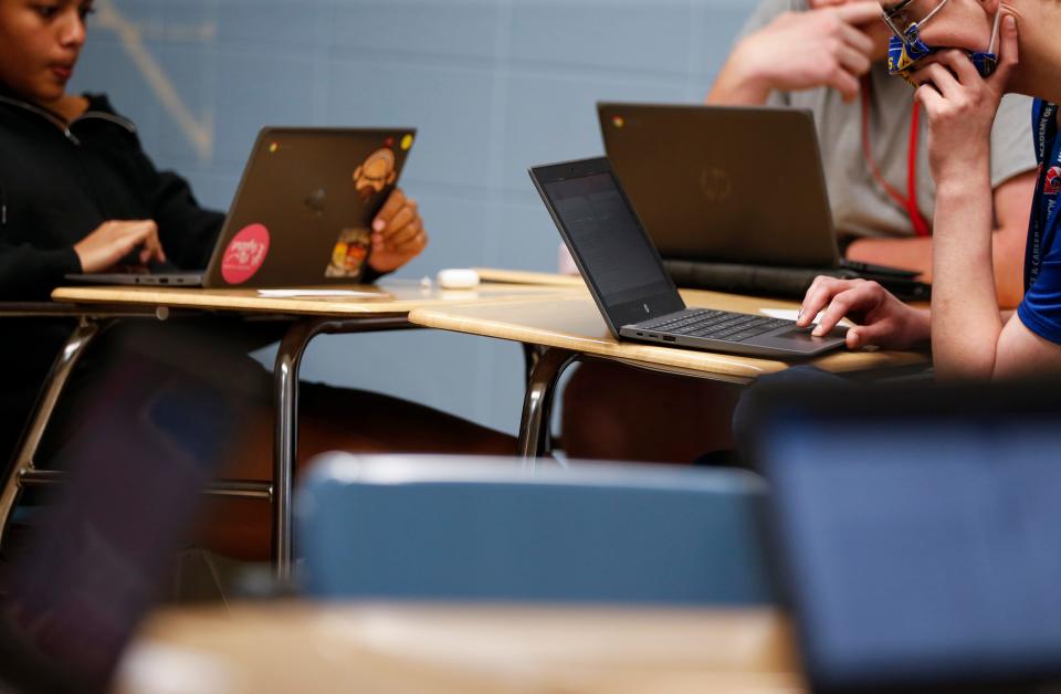 Students use Google Chromebooks to take end-of-course tests in a high school classroom. Under a waiver, 20 Missouri districts will have the option of using an alternative to the state-mandated exams.