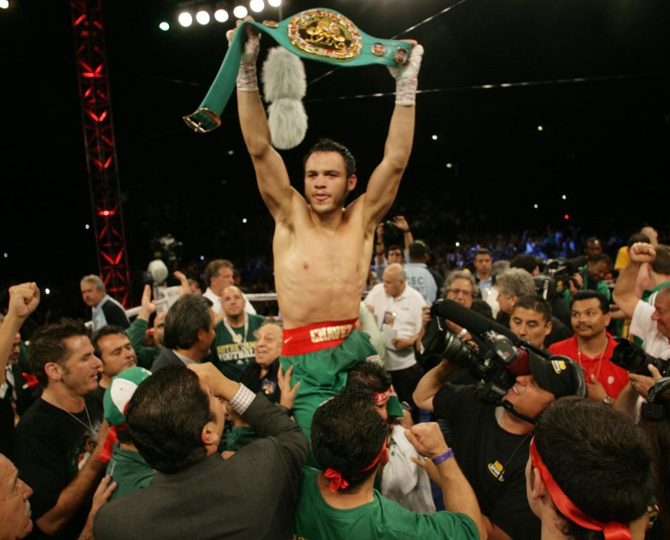 Julio Cesar Chavez Jr. celebrates his victory over Andy Lee in their WBC middleweight title bout on Saturday, June 16, 2012, in the Sun Bowl in El Paso.