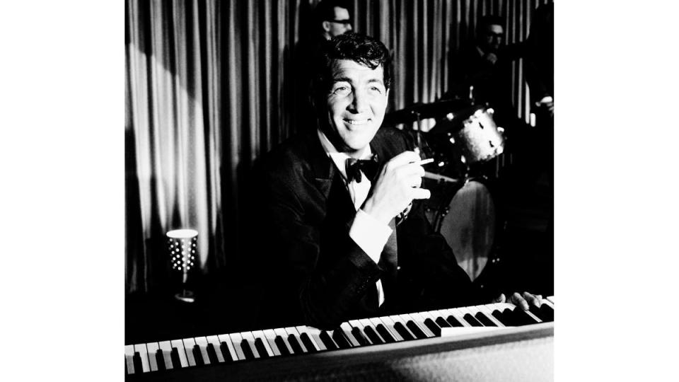 Dean Martin Songs: Dean Martin sitting at piano