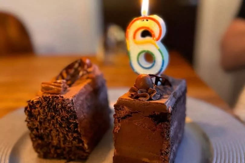 Cake with a '6' candle on the top, shared by Oti Mabuse to mark six months since her daughter's birth