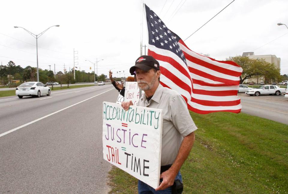 TIM ISBELL/SUN HERALDIrby Tillman pickets with other SRHS members in front of Singing River Hospital in Pascagoula Wednesday, March 30, 2016.