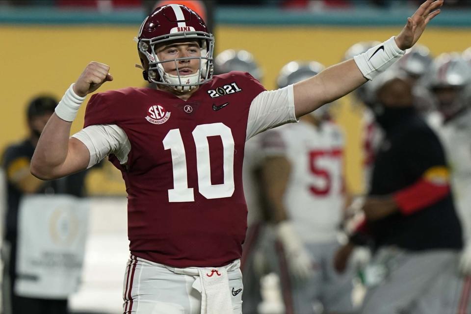 Alabama QB Mac Jones celebrates after a touchdown by WR DeVonta Smith during the first half of a College Football Playoff title game against Ohio State on Jan. 11. (AP)