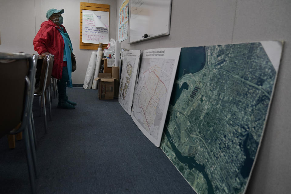 Margaret Gordon, a co-founder of the West Oakland Environmental Indicators Project, stands in her office while interviewed in Oakland, Calif., Thursday, Feb. 18, 2021. Disadvantaged communities in America are disproportionately affected by pollution from industry or waste disposal, but their complaints have few outlets and often reach a dead end. (AP Photo/Jeff Chiu)