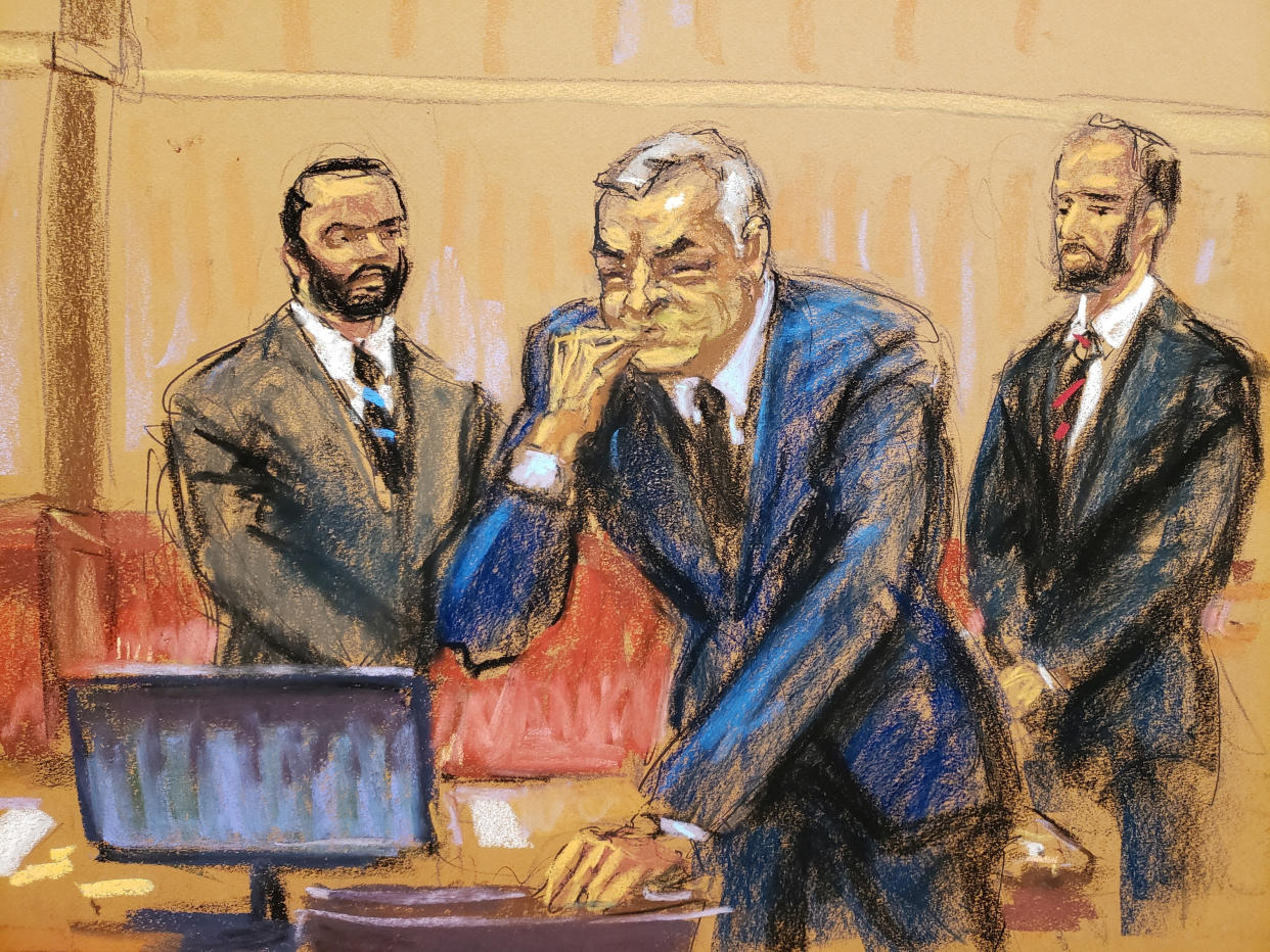 Courtroom sketch of García Luna holding his hand to his mouth.