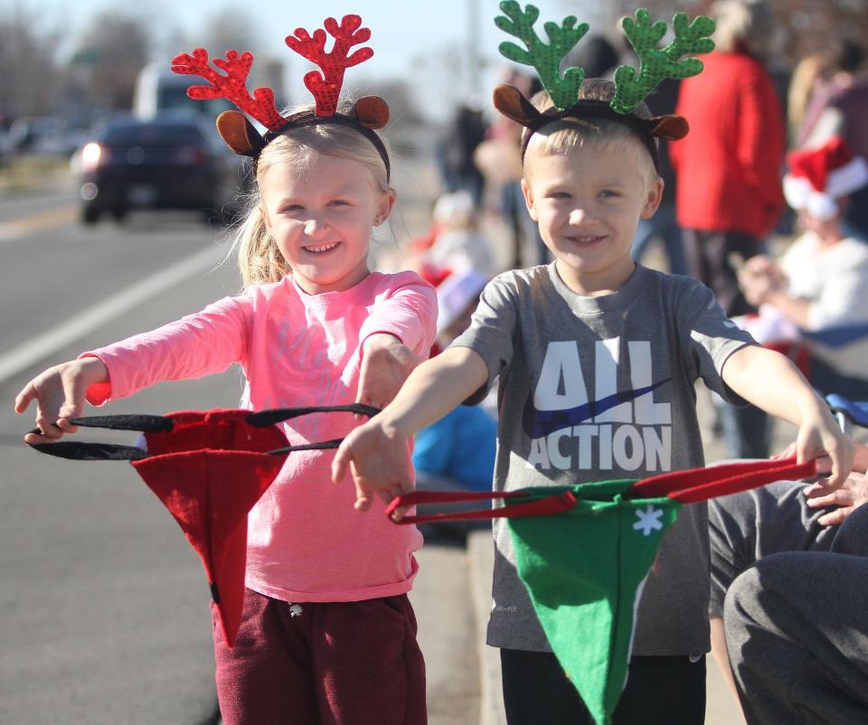 Emma and Cooper Floyd Mott came prepared to gather candy at the White House Christmas parade on Saturday, Dec. 5, 2020.