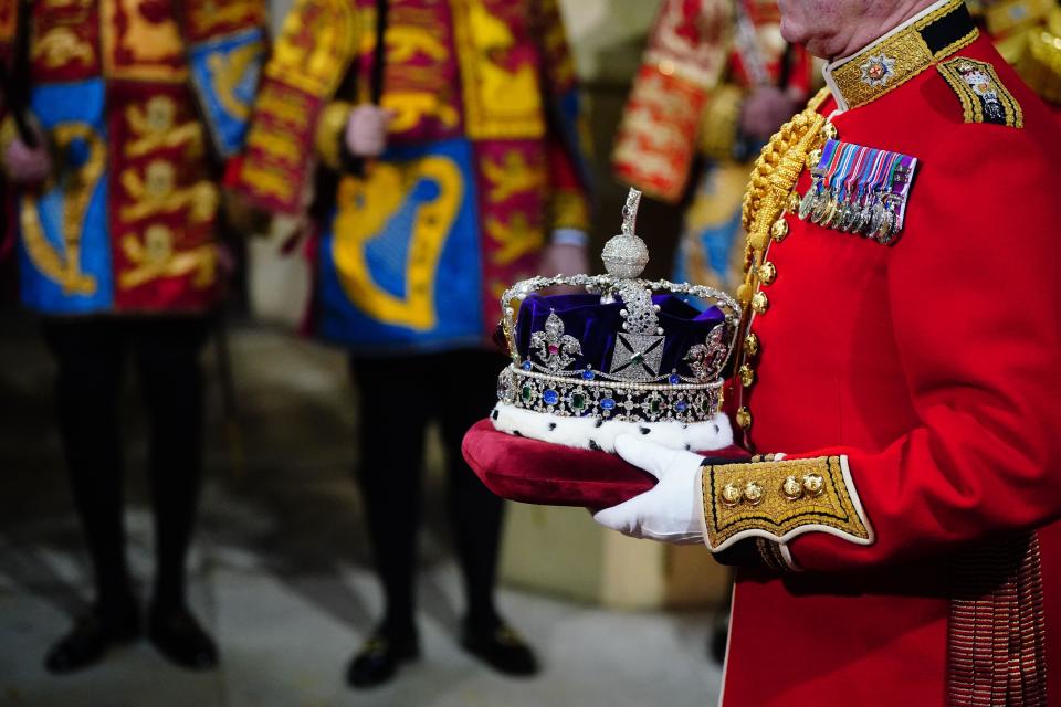 The Imperial State Crown is carried through the Norman Porch for the State Opening of Parliament in the House of Lords, London. Picture date: Tuesday November 7, 2023.