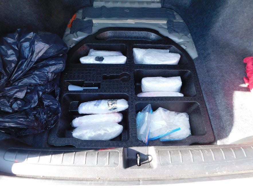 a Texas state trooper stopped a 2021 Honda Accord traveling east on I-40 near Vega for a traffic violation and found 11 plastic-wrapped bundles of methamphetamine and one plastic bag containing fentanyl pills in the trunk area.