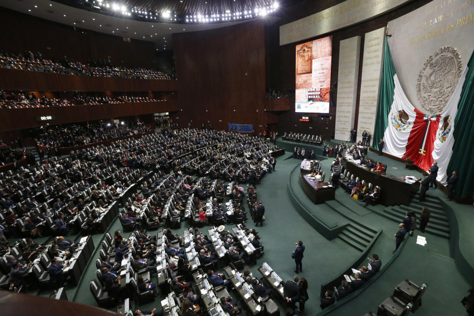 FILE - Legislators fill the lower house of Congress as the wait for the presidential inauguration ceremony of Andres Manuel Lopez Obrador, at the National Congress in Mexico City, Dec 1, 2018. Lopez Obrador is in a rush to finish the big legislative and building projects he promised before his term ends in September 2024, (AP Photo/Marco Ugarte, File)