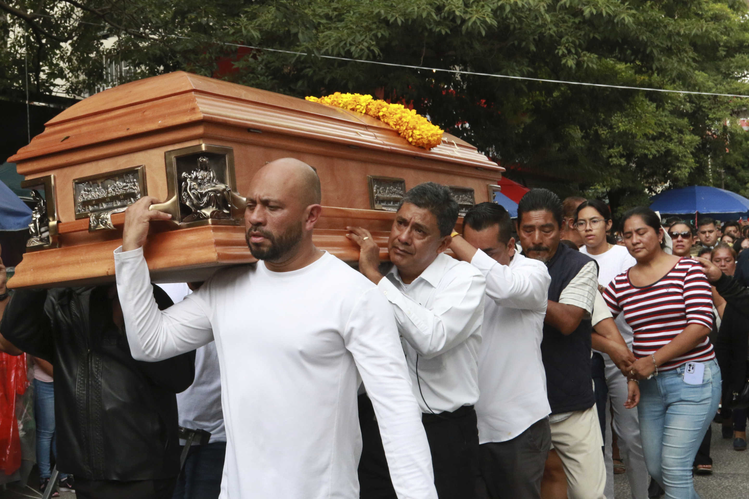 Relatives of slain Mayor Alejandro Arcos carry his coffin during his funeral service, one week after he took office, in Chilpancingo, Guerrero state, Mexico, Monday, Oct. 7, 2024. (AP Photo/Alejandrino Gonzalez)