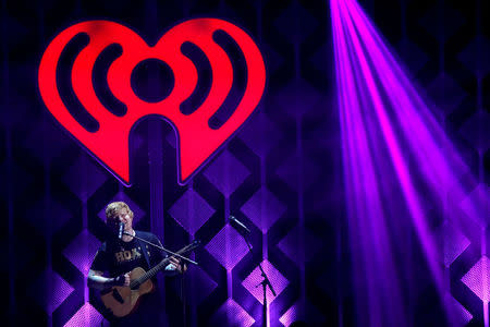 FILE PHOTO: Ed Sheeran performs during iHeartRadio Jingle Ball Tour at The Forum in Inglewood, California, U.S., December 1, 2017. REUTERS/Mario Anzuoni/File Photo