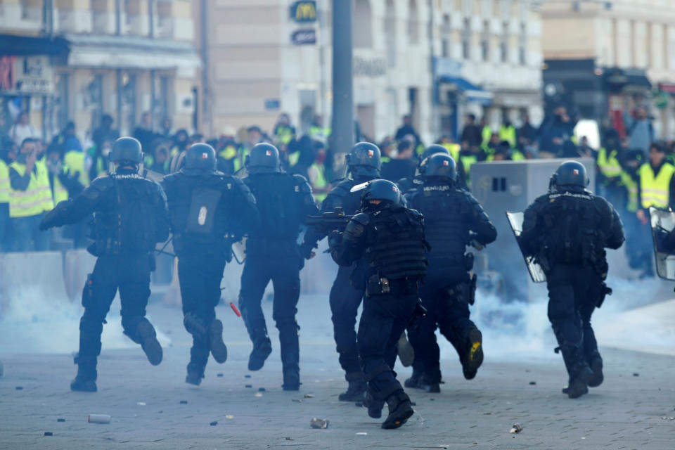 Tear gas fills the air as French Gendarmes advance during clashes at a demonstration of the “yellow vests” movement in Marseille, France, Dec. 8, 2018. (Photo: Jean-Paul Pelissier/Reuters)