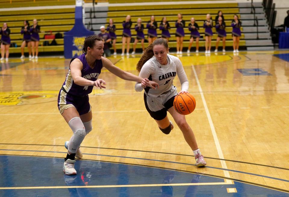 Calvary's Hannah Cail attempts to drive the ball past Lumpkin County's Averie Jones during the 3A semifinals on Friday March 3, 2023 at Fort Valley State University.