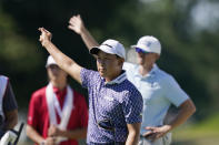 Dylan Wu signals after driving off the 18th tee during the second round of the Rocket Mortgage Classic golf tournament, Friday, July 29, 2022, in Detroit. (AP Photo/Carlos Osorio)