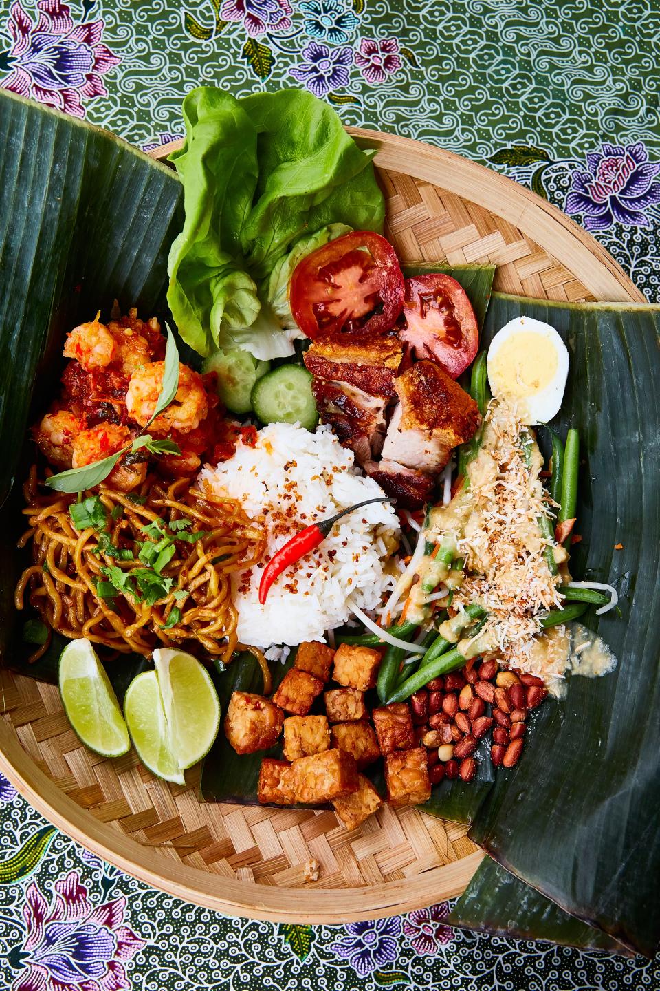 ChiliCali's Nasi Campur: Steamed jasmine rice, mie goreng (fried noodles), shrimp sambal, roast pork belly, and Balinese urab salad with egg, tempeh and roasted peanuts