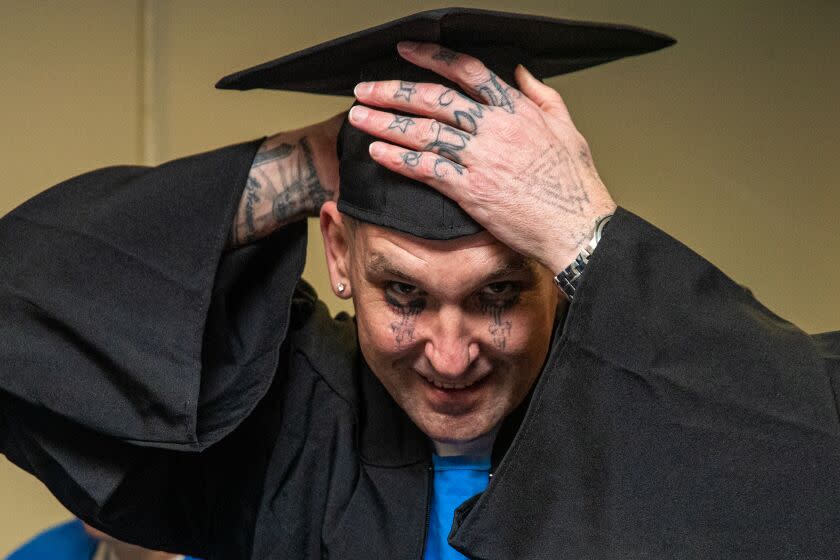 Lancaster, CA - February 28: Graduating inmate Richard Teer, 46, in cap and gown ready for Offender Mentor Certification Program graduation ceremony at California State Prison on Tuesday, Feb. 28, 2023 in Lancaster, CA. (Irfan Khan / Los Angeles Times)