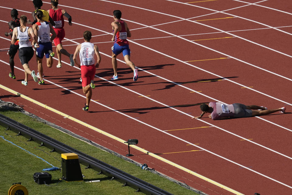 Brandon Mcbride, of Canada, falls during a heat in the men's 800-meter run at the World Athletics Championships on Wednesday, July 20, 2022, in Eugene, Ore. (AP Photo/Gregory Bull)