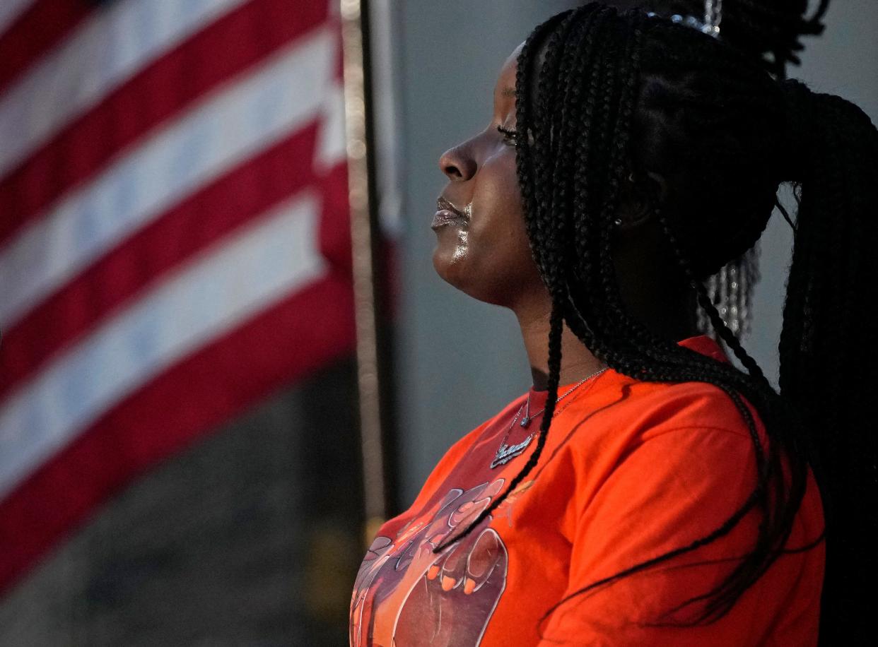 Tears highlight the face of Jazmond Brown, 16, who spoke during a gun violence awareness vigil Friday evening at Columbus City Hall to honor those lost to gun violence and kick off "Wear Orange" weekend. Anti-gun-violence activists nationwide wear orange because it is the color hunters wear in the woods to keep themselves from being shot.