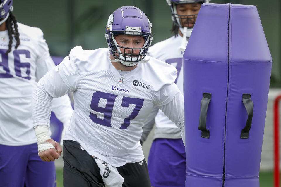 FILE -Minnesota Vikings defensive tackle Harrison Phillips takes part in drills at the NFL football team's practice facility in Eagan, Minn., Tuesday, May 17, 2022. The Minnesota Vikings are transitioning to a 3-4 defense and leaning on returner Dalvin Tomlinson and newcomer Harrison Phillips to anchor the interior of the line and serve as the primary run-stoppers for a unit trying to bounce back from a second straight substandard season.(AP Photo/Bruce Kluckhohn, File)