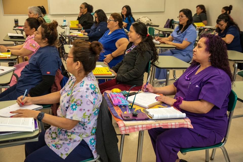 A group of women sitting in class.