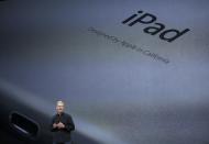 Apple Inc CEO Tim Cook speaks about the new iPad Air during an Apple event in San Francisco, California October 22, 2013. REUTERS/Robert Galbraith (UNITED STATES - Tags: BUSINESS TELECOMS SCIENCE TECHNOLOGY)