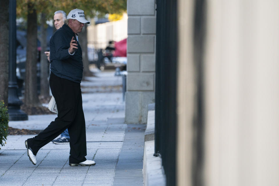 President Donald Trump returns to the White House after playing a round of golf, Saturday, Nov. 7, 2020, in Washington. (AP Photo/Evan Vucci)