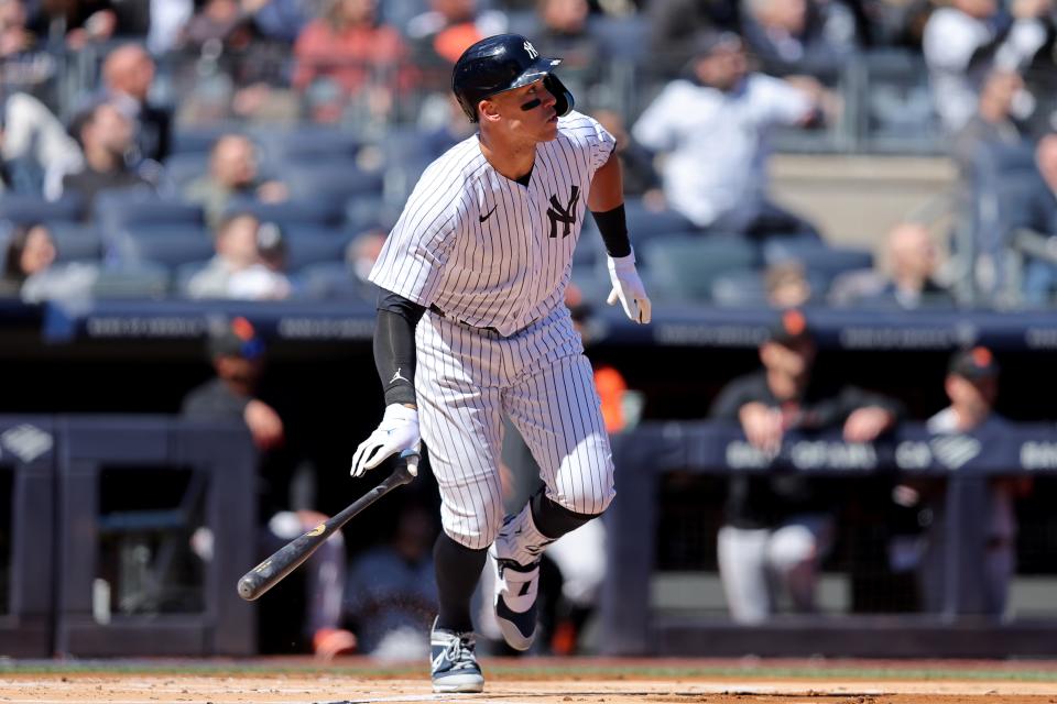 Mar 30, 2023; Bronx, New York, USA; New York Yankees center fielder Aaron Judge (99) watches his solo home run against the San Francisco Giants during the first inning at Yankee Stadium. Mandatory Credit: Brad Penner-USA TODAY Sports