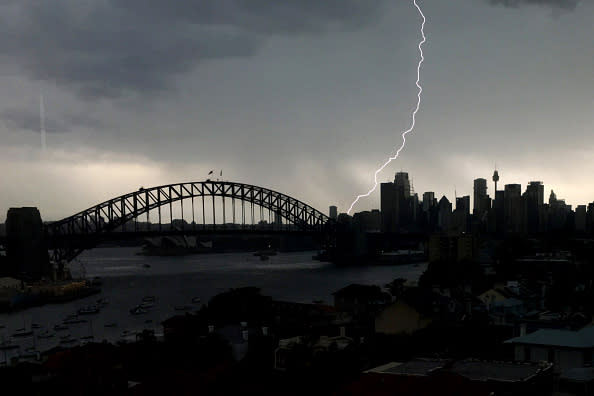 A lightning bolt hits the pylon on the Sydney Harbour Bridge in Sydney, Australia. 