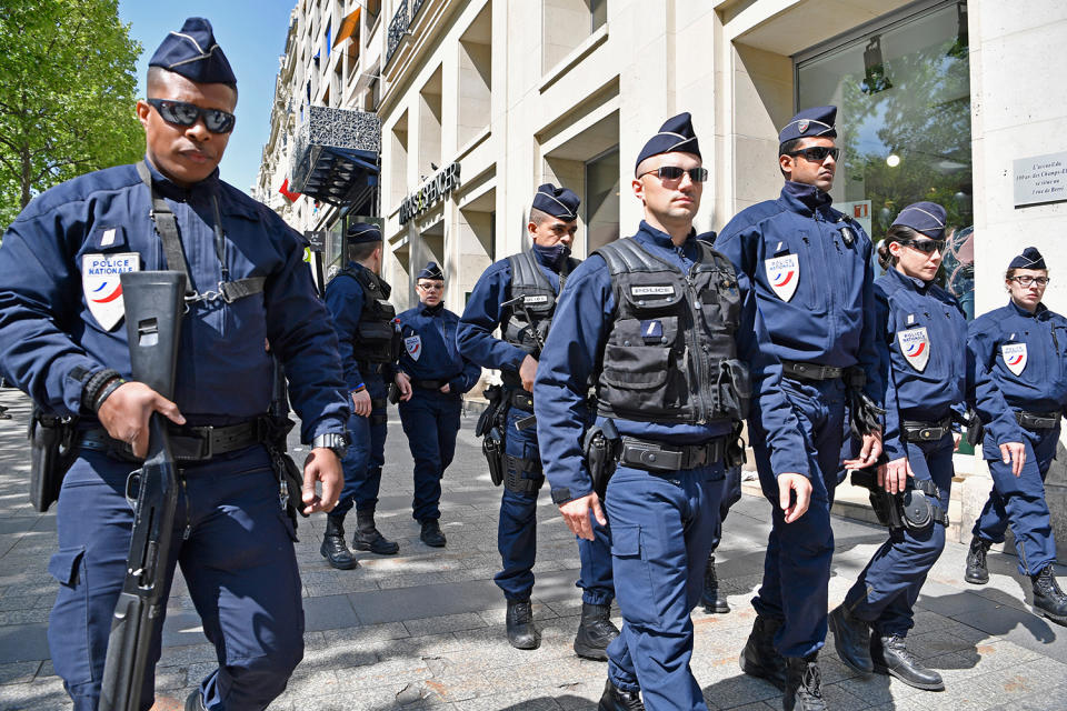 Police walking along Champs Elysees