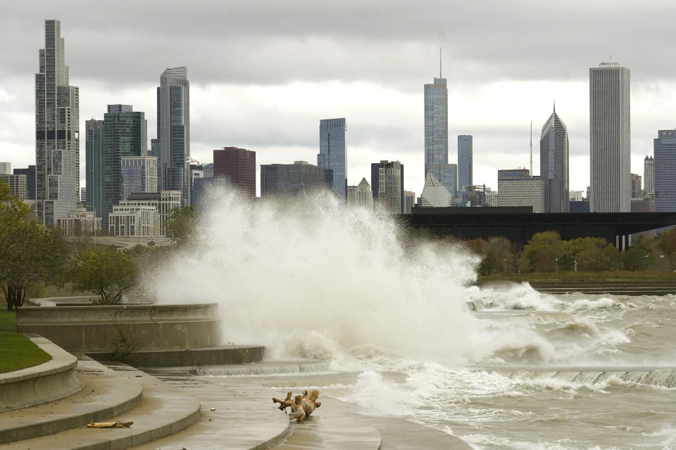 Waves batter the Lake Michigan shoreline at Chicago's 31st Street beach as a wind advisory remains in effect with wind gusts of 40 to 50 mph causing high waves and lakefront flooding Monday, Oct. 25, 2021. (AP Photo/Charles Rex Arbogast)