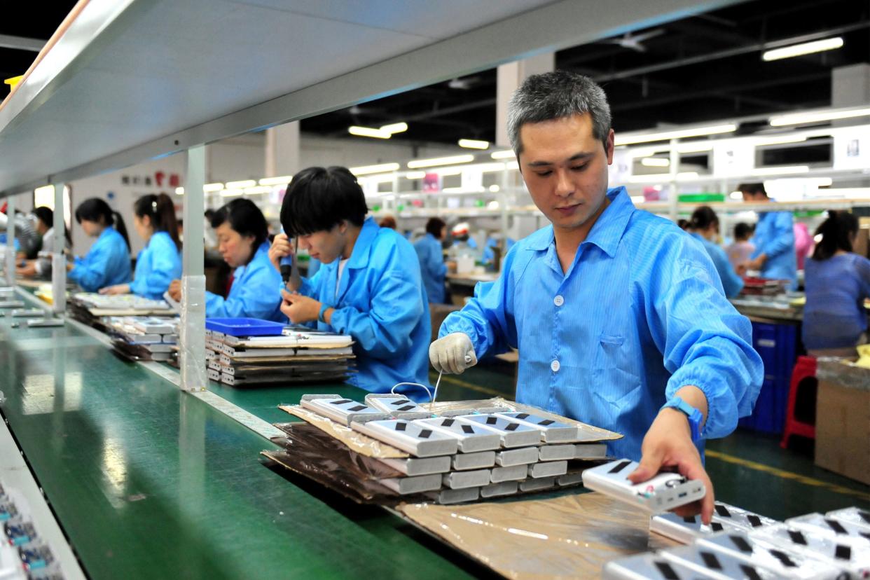 Employees working on a production line.