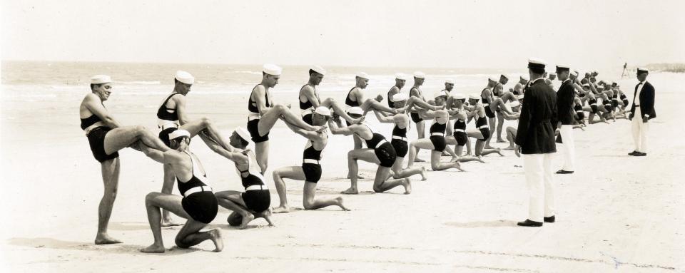 In 1925, liifeguards from the American Red Cross Volunteer Lifesaving Association perform a drill at what was then Pablo Beach, now Jacksonville Beach.