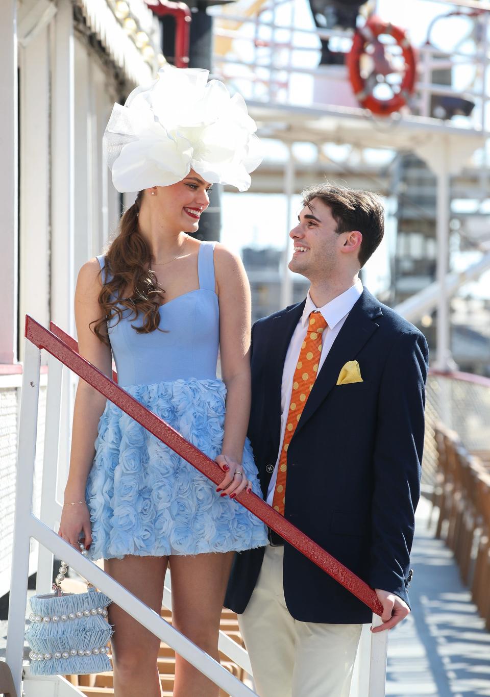 Models Caden Stover and Emily Kulp stand aboard the Belle of Louisville and show off the latest Kentucky Derby fashions for men and women ahead of Kentucky Derby 150.