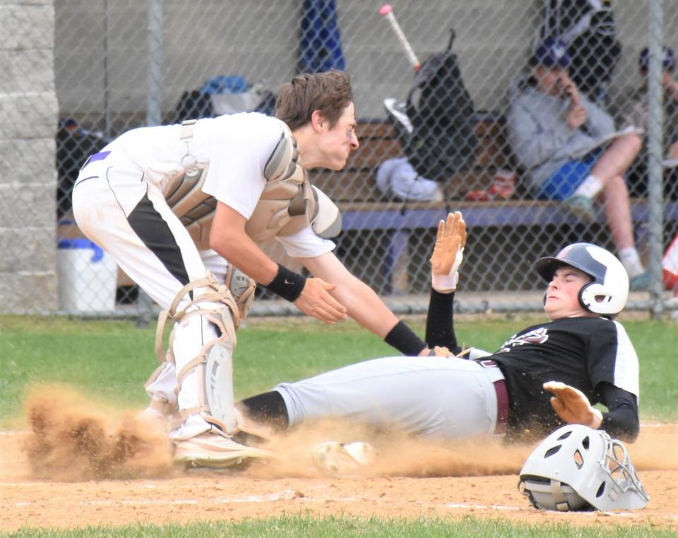 West Canada Valley catcher Josh Grabowski tags out Frankfort-Schuyler Maroon Knight Brayden Wisheart (right) to complete a sixth-inning double play Saturday.