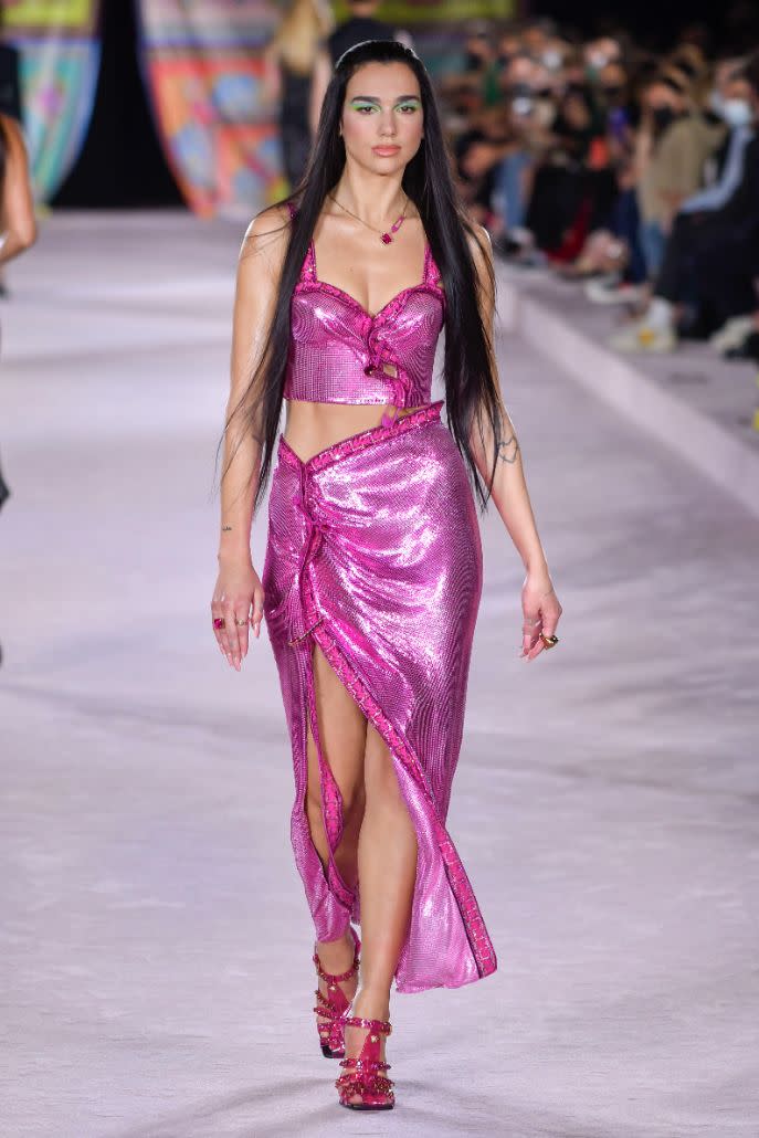 Dua Lipa walks the runway for Versace spring ’22 show. - Credit: Moda Milano/IPA/Splash News