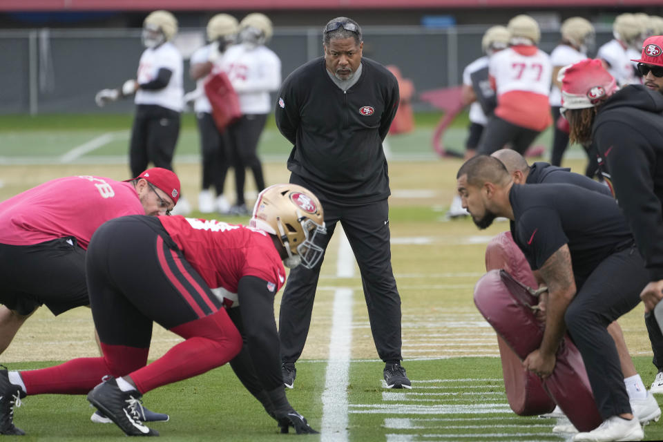 San Francisco 49ers defensive coordinator Steve Wilks, center, watch as players practice at the team's NFL football training facility in Santa Clara, Calif., Thursday, Feb. 1, 2024. The 49ers will face the Kansas City Chiefs in Super Bowl 58. (AP Photo/Tony Avelar)