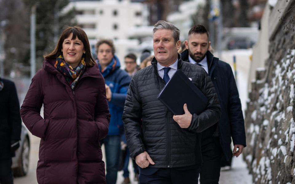 Sir Keir Starmer and Rachel Reeves arrive in Davos - FABRICE COFFRINI/AFP