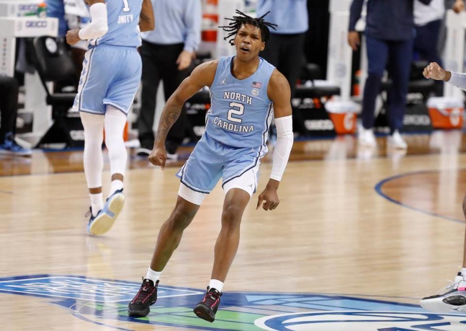 North Carolina’s Caleb Love (2) celebrates after making a basket during the first half of UNCs game against Virginia Tech in the quarterfinals of the ACC Mens Basketball Tournament in Greensboro, N.C., Thursday, March 11, 2021.