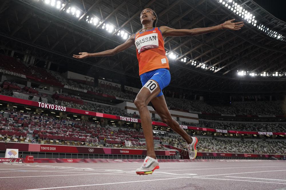 Sifan Hassan, of the Netherlands, celebrates as she crosses the finish line to win the women’s 5,000-meters final at the 2020 Summer Olympics, Monday, Aug. 2, 2021, in Tokyo. (AP Photo/David J. Phillip)