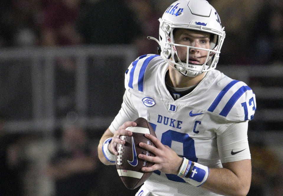 FILE - Duke quarterback Riley Leonard (13) looks for a receiver during the second half of an NCAA college football game against Florida State, Saturday, Oct. 21, 2023, in Tallahassee, Fla. Duke quarterback Riley Leonard entered the transfer portal, signaling his departure from the Blue Devils after two seasons as a starter. Leonard immediately becomes the one of — if not the — most talented quarterback available in college football’s transfer market. (AP Photo/Phelan M. Ebenhack)